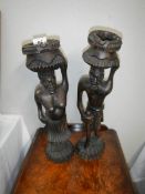 A pair of carved wood tourist tribal figures