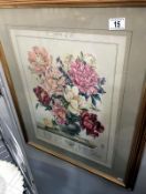 A framed and glazed floral print