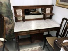 A marble topped washstand with inset tiles