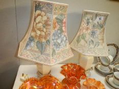 A pair of table lamps with shades