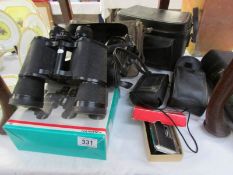 A mixed lot of binoculars and photographic equipment