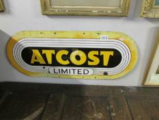 An 'ATCOST' enamel sign