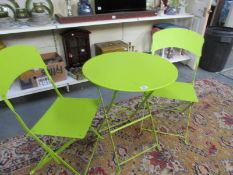 A metal folding garden table and 2 matching chairs