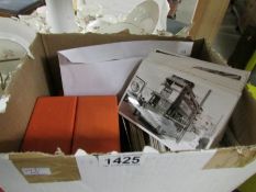 A box containing a quantity of photographic prints,