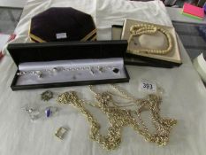A mixed lot of costume jewellery with jewellery box