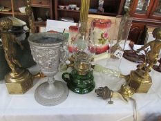 A green glass hand oil lamp and other oil lamp parts