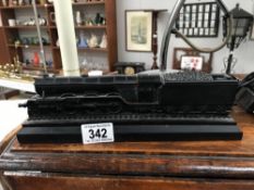 A carved coal model locomotive