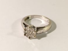 An 18ct white gold 7 stone diamond ring,