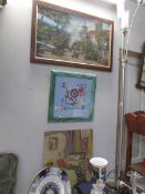 3 embroidered pictures including spinning wheel and town scene