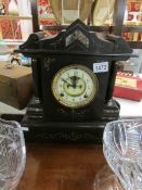 A 19th century black marble Paladian style clock