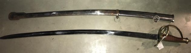 A 20th century copy of a sabre with brass hilt and in scabbard