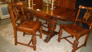 A drawleaf table and 4 chairs