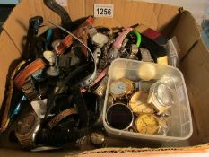 A box of various watches and watch heads