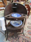 A mahogany corner wash stand with 2 blue and white bowls