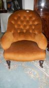 An upholstered chair with buttoned back