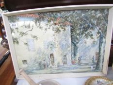 A framed and glazed village scene