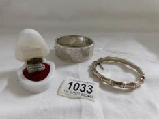 2 silver bangles and a silver ring