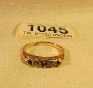 An 18ct gold ring set diamonds and sapphires,