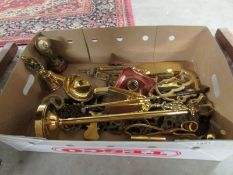 A box of assorted brass ware