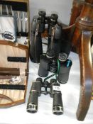 A cased pair of cross channel long range binoculars a/f,