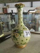 A hand painted vase with signature on base