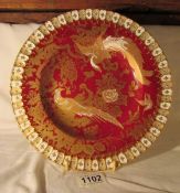 A Royal Crown Derby cabinet decorated with peacocks in red and gold