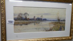 A framed and glazed watercoloour 'Church on River' signed Robert Winter,