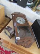 An oak wall clock and a bakelite mantel clock
