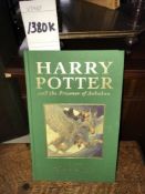 A green bound copy of Harry Potter and The Prisoner of Azkaban signed by J.K.