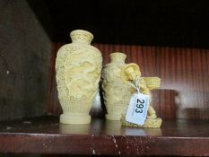 A pair of oriental vases and a figure