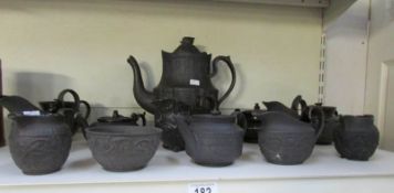 A collection of Wedgwood black jasper ware,