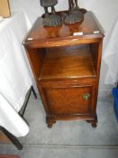 A walnut pot cupboard