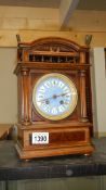 A mantel clock with enamel dial