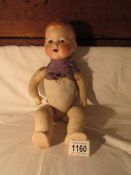 A German Armand Marsielle bisque headed doll marked 352