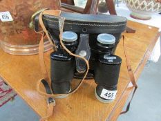 A pair of cased binoculars