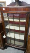 A mahogany display cabinet