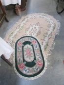 2 oval wool rugs