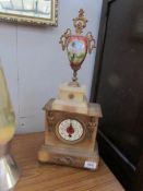 A French alabaster clock surmounted Sevres finial,