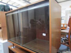 A glazed sliding door cabinet