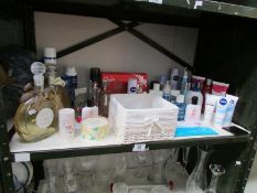 A shelf of toiletries etc