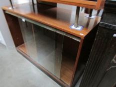A glazed sliding door cabinet