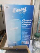 An Easydry electric clothes drier with accessories (never used)