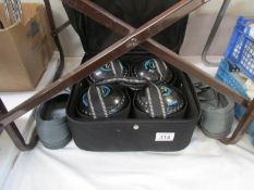 An Esmor bowls bag containing 4 Drakes Price bowls and size 9 bowling shoes