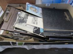 A box of old photographs etc