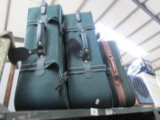 3 green suitcases