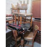 A draw leaf table and 6 chairs