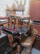 A draw leaf table and 6 chairs