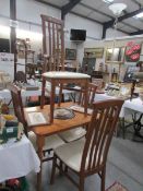 A dining table and 4 chairs