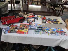A large quantity of boxed and unboxed die cast including Lledo, Hotwheels,