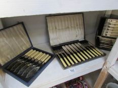 3 cased sets of cutlery